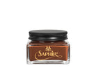A glass jar with a black lid labeled 'SAPHIR' containing cream shoe polish.