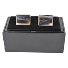 A pair of black rectangular oxhorn cufflinks with a rhodium finish and a swivel barrel design.