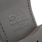 A Berwick 1707 brown brogue derby shoe with a round toe shape and lace-up closure. It features a grainy texture and brogue detailing & Dainite soles