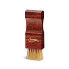 A shoe cream applicator brush with a wooden handle and boar bristles, branded with 'Saphir'.