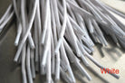 A close-up of white waxed round dress shoe laces
